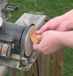 Sanding the jewelry pieces